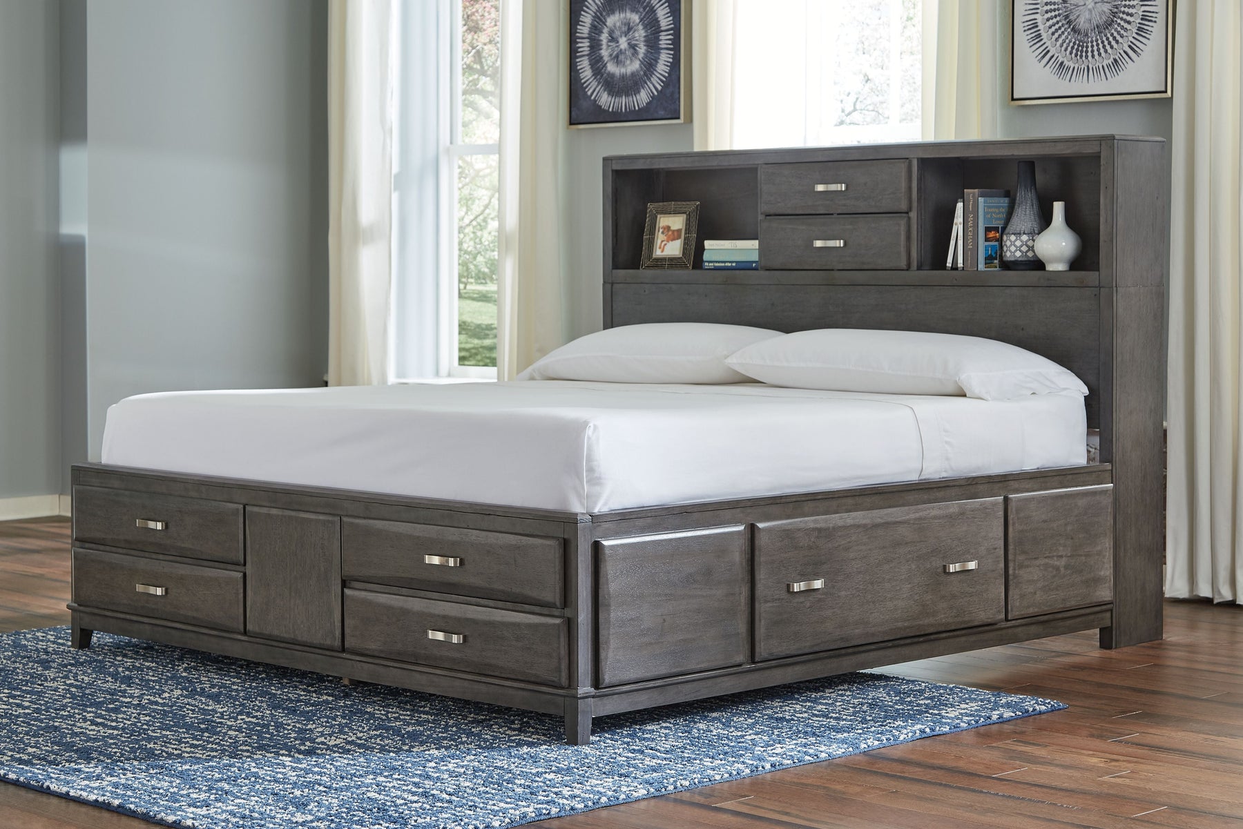 a bed with white mattress and pillows