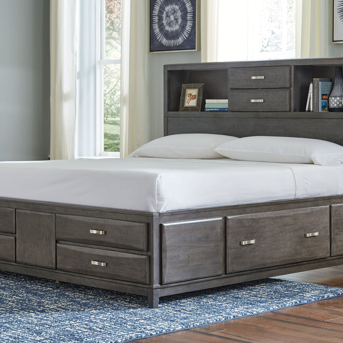 a bed with white mattress and pillows
