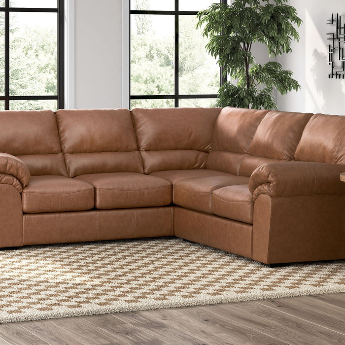 Umber-hued faux leather WillowBend sectional sofa.