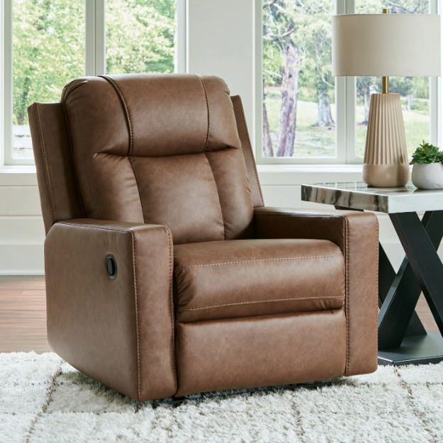A comfortable brown recliner in a bright living room, offering the perfect spot to relax – How to Choose the Right Recliner.