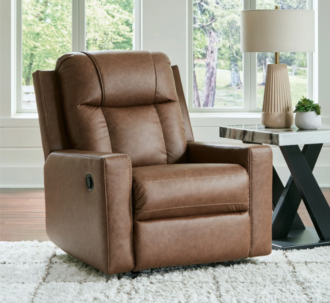 A comfortable brown recliner in a bright living room, offering the perfect spot to relax – How to Choose the Right Recliner.